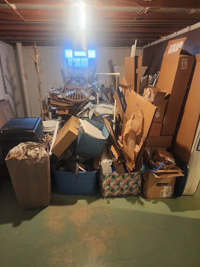 Roll-off dumpster container at job site for 4 Yard Dumpster Rental in Atkinson